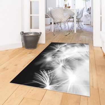 Vinyl Floor Mat - Moving Dandelions Close Up On Black Background - Landscape Format 3:2