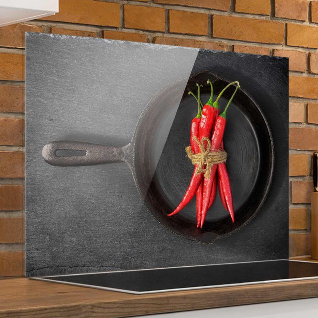Kitchen Bundle Of Red Chillies In Frying Pan On Slate