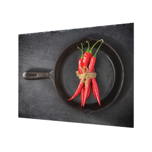 Glass splashback kitchen Bundle Of Red Chillies In Frying Pan On Slate
