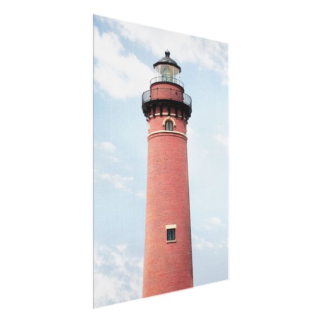 Glass prints landscape Red Lighthouse On Sky Blue Backdrop