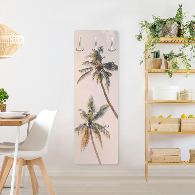 Wall mounted coat rack Two palm trees against a pink sky